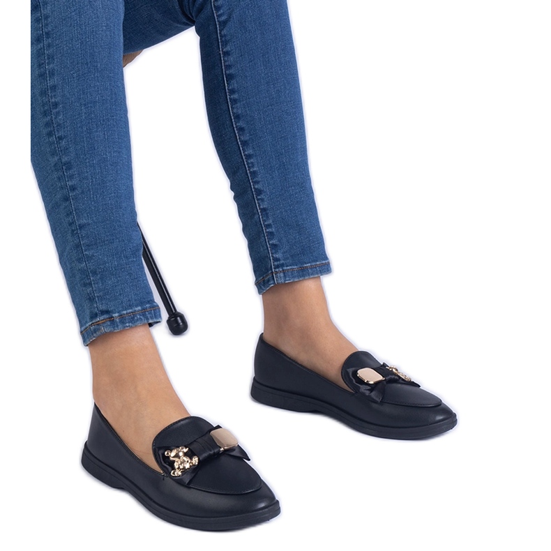 Plăcile negre decorate cu un arc și un ursuleț de aur auriu negru Plăcile negre decorate cu un arc și un ursuleț de aur auriu negru