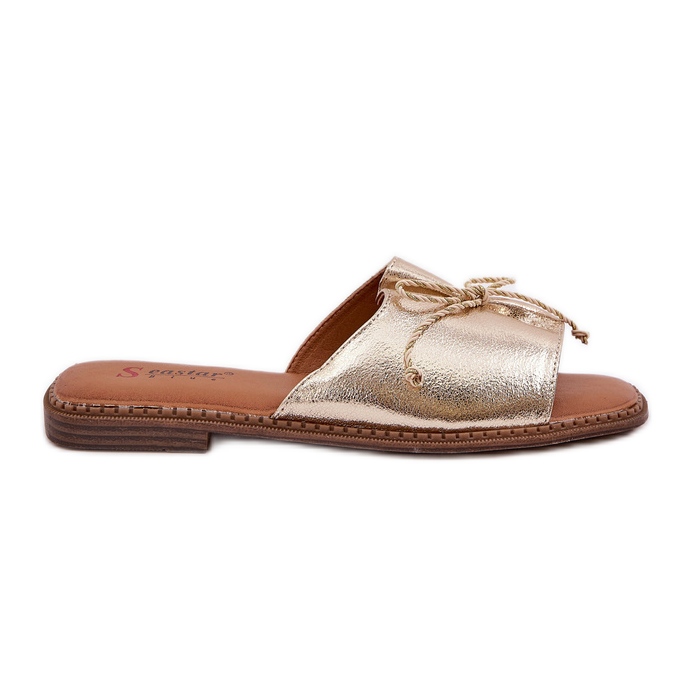 Flip -flops cu talpă plat cu un arc decorativ de aur Flip -flops cu talpă plat cu un arc decorativ de aur