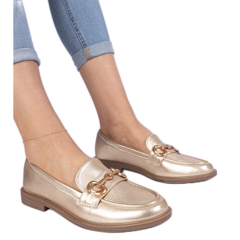 Plăcile pentru femei de aur cu decorare de aur