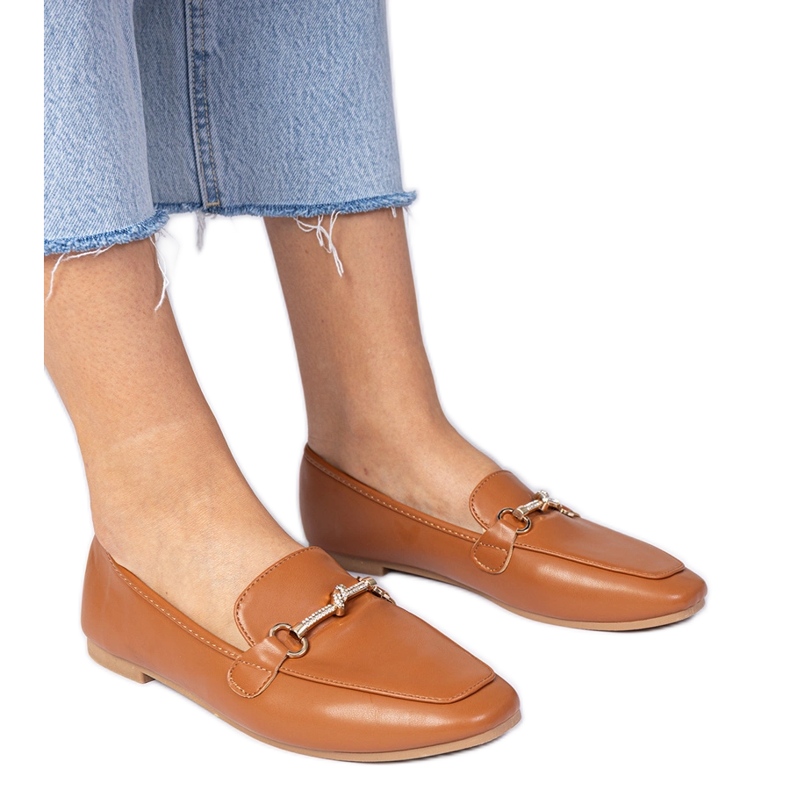 Plăcile elegante maro cu decor auriu și zircoane