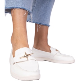 Plăcile de femei albe cu o decorare de aur