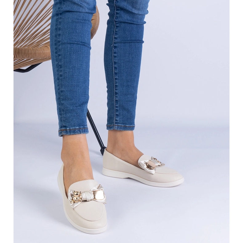 Plăcile bej decorate cu un arc și un ursuleț de aur 1