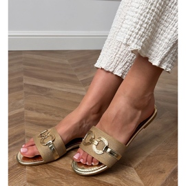 Flip -flops auriu cu un decor de aur pe curea 1