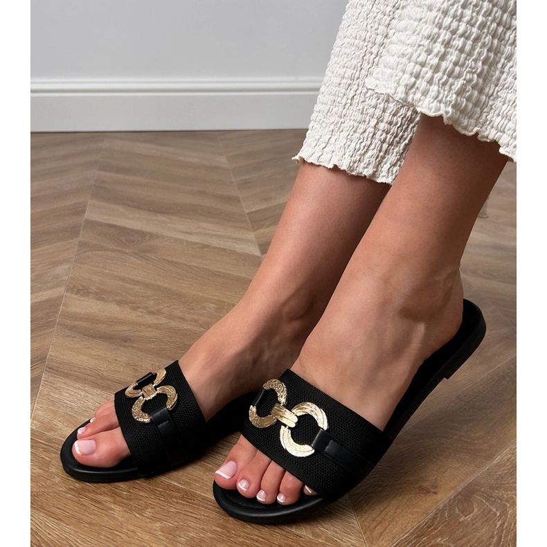 Flip -flops negru cu un decor auriu pe bară 1