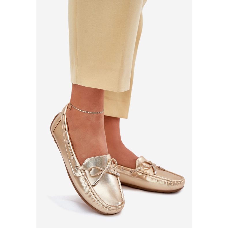 Plăcile de aur din piele eco -feminină cu un arc 1